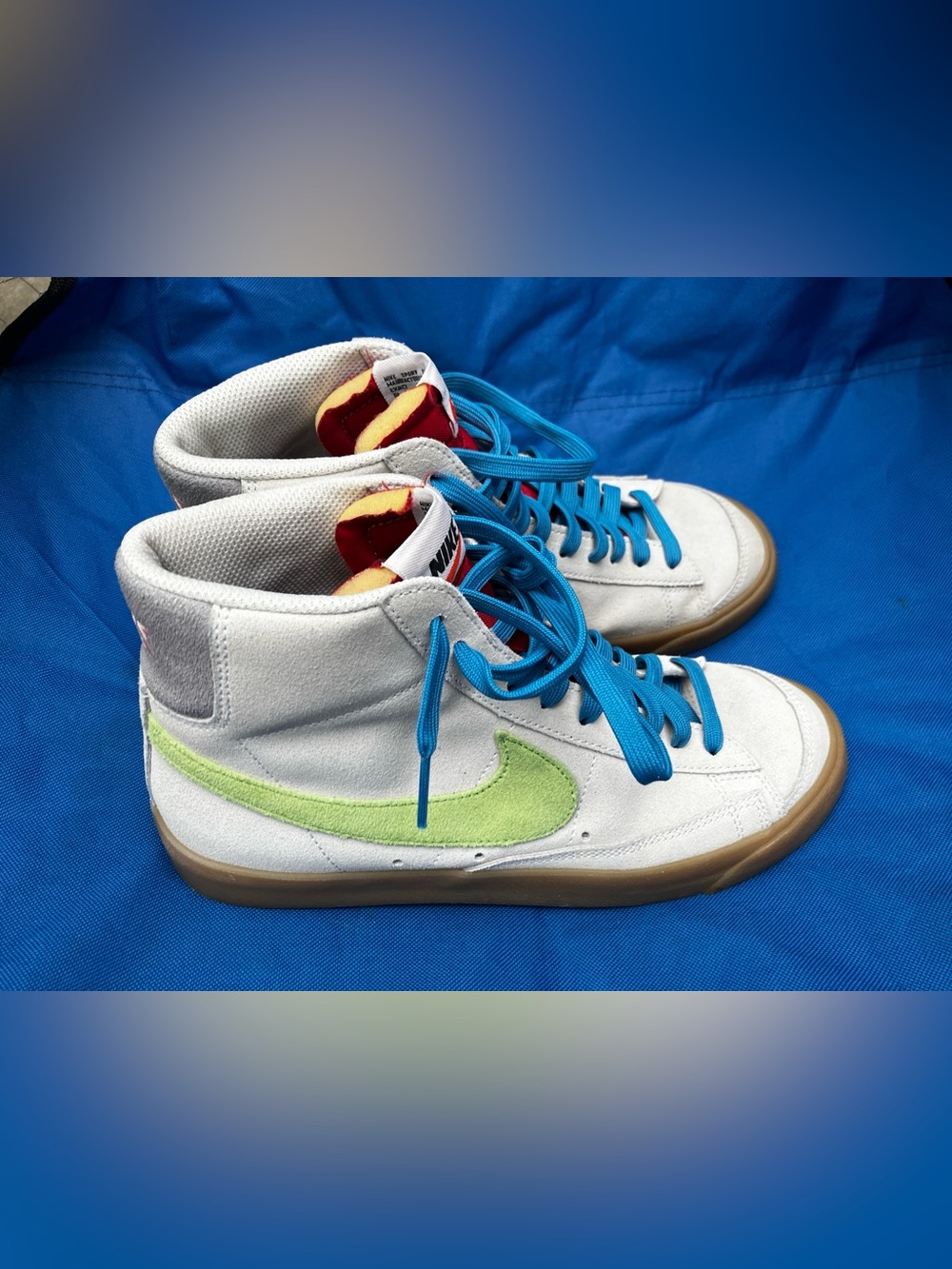 Nike High-Top Sneakers in Off White with Lime and Purple Swoosh and Blue Laces